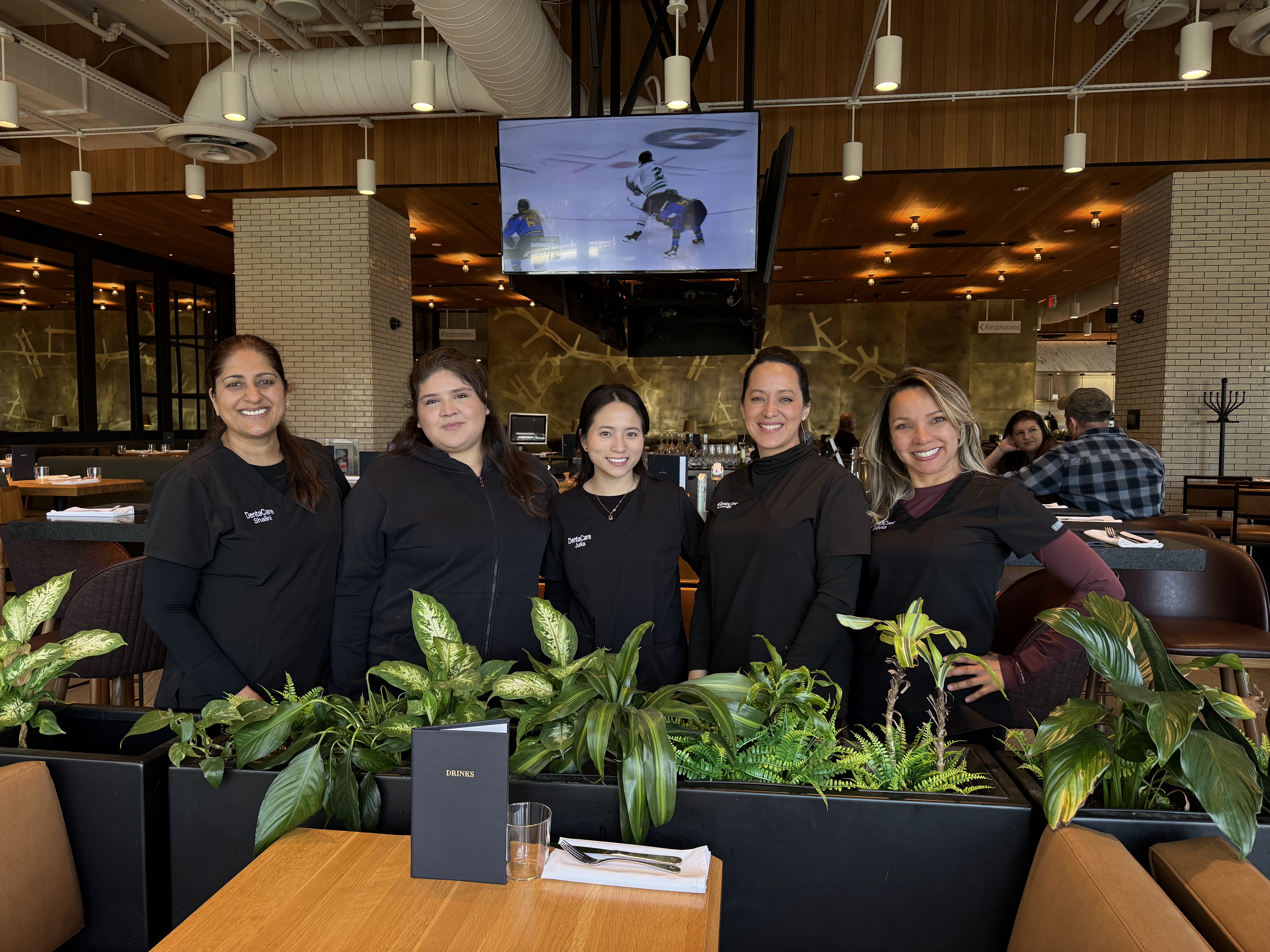 DentaCare team smiling together